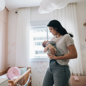 Woman rocking her baby